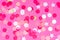 Multicolor pink, gold and white confetti on the bold pink background, holiday celebration backdrop