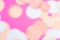 Multicolor pink, gold and white confetti on the bright pink background in blur, holiday celebration backdrop