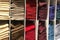 Multicolor socks stacked on shelf in tidy appearance in a clothing store. multicolor sock background