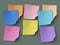 Multicolor sticky notes on gray