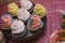 Multicolor Sweets on Candy Buffet with Cupcakes, Cookies and Mar