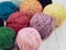 Multicolor wool, balls of wool on grey background
