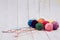 Multicolor wool, balls of wool on wood background