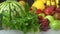 Multicolored background juicy and fresh herbs, fruit and vegetables on ice