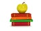Multicolored book tower with yellow apple