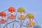 Multicolored booths of a ferris wheel over a blue sky background with a sunny day. Seafront in Bulgaria, Golden Sands