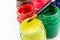 Multicolored bottles poster color and paintbrush  on a white background Isolated Paints in containers.