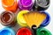 Multicolored bottles poster color and paintbrush on a white background Isolated Paints in containers .