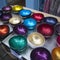 Multicolored bowls of coconut shell with rain drops