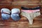 Multicolored bras and panties on wooden background