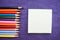 Multicolored, bright, colorful pencils for drawing located on the left