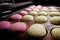 Multicolored buns for burgers on a baking tray