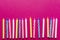 Multicolored candles for cake on paper background