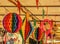 Multicolored circular paper balloons hanging off the roof during June party in Brazil