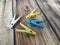 Multicolored clothespins on a wooden table