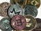 Multicolored coins cryptocurrencies bitcoin Ethereum and others close up on a light background