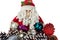 Multicolored cones and fur-tree toys on the background of a toy Santa. Christmas and New Year greeting card