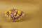 Multicolored cornflakes rings in a plate close-up. Breakfast cereals.