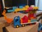 Multicolored Crane truck build in lego by a small child at home