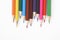 Multicolored crayons on white background