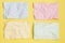 Multicolored crumpled sheets on yellow background, texture for web design screensavers