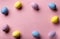 Multicolored decorated eggs on a pink background. easter concept.