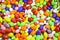 Multicolored dragee drop candy background