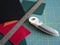 Multicolored felts  a rotary cutter and a ruler on the cutting mat. Sewing tools and materials. Preparing to a handwork