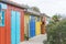 Multicolored fisher`s huts on coastline of Atlantic ocean