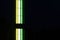 Multicolored fluorescent street lamp on dark blurred background