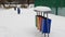 Multicolored garbage can garbage container for municipal waste and industrial waste, snow, winter, ecology