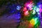 Multicolored glowing Christmas balls garlands close-up