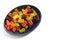 Multicolored gummy bears in black bowl on white background. Top view, copy space. Chewing gummies on plate