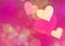 Multicolored hearts bokeh background of a Love symbol