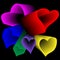 Multicolored hearts with transition effect on a black background.