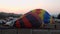 Multicolored hot air balloons during inflation