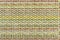 Multicolored knitted fabric background texture. Ð¡olorful fabric with a pattern, Fragment colored wool carpet, bright wicker