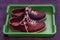 Multicolored leather shoes with laces, a pair, for playing bowling in a plastic tray