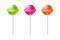 Multicolored lollipops. Green caramel candy on stick pink delicious dessert