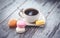 Multicolored macaroon and vintage coffe cup