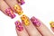 Multicolored manicure with dots.