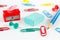 Multicolored office supplies on white desktop closeup