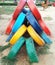 Multicolored and painted used tyres arranged in V shapes kept in children park