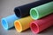 Multicolored paper tubes background graphic design resource