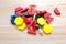 Multicolored pattern blocks on a light wooden background