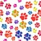 Multicolored paw track seamless pattern on transparent background. Hand drawn vector illustration.