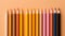 Multicolored pencils, drawing tools and hobbies. Solid color background