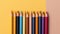 Multicolored pencils, drawing tools and hobbies. Solid color background