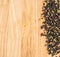 Multicolored Peppercorns on Wooden Background. Dry Peper Mix