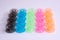 Multicolored plastic bobbin for sewing machine layed in rows in